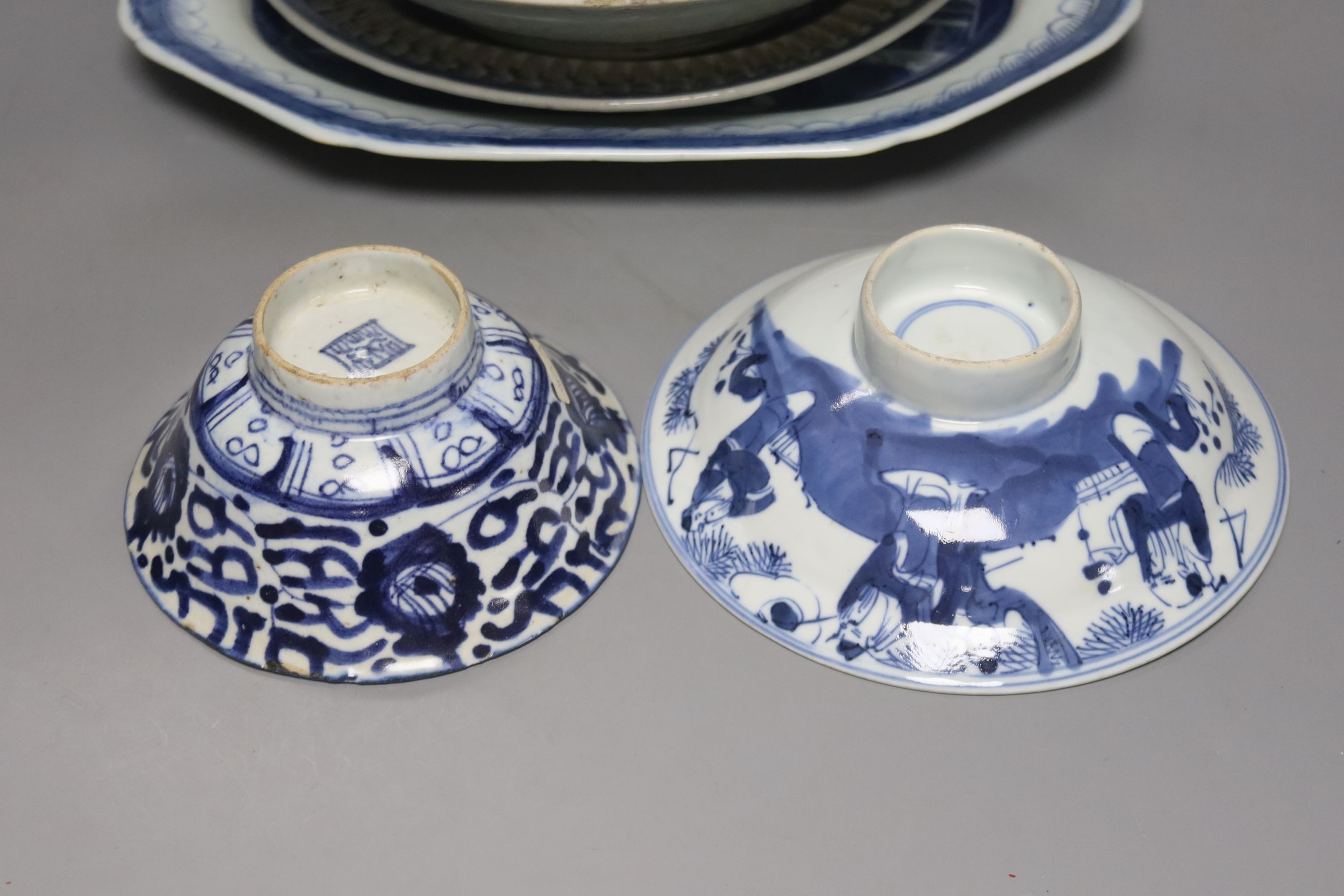 Two 19th century Chinese blue and white dishes and various jars and brush pots, largest item meat platter 33cms wide.
